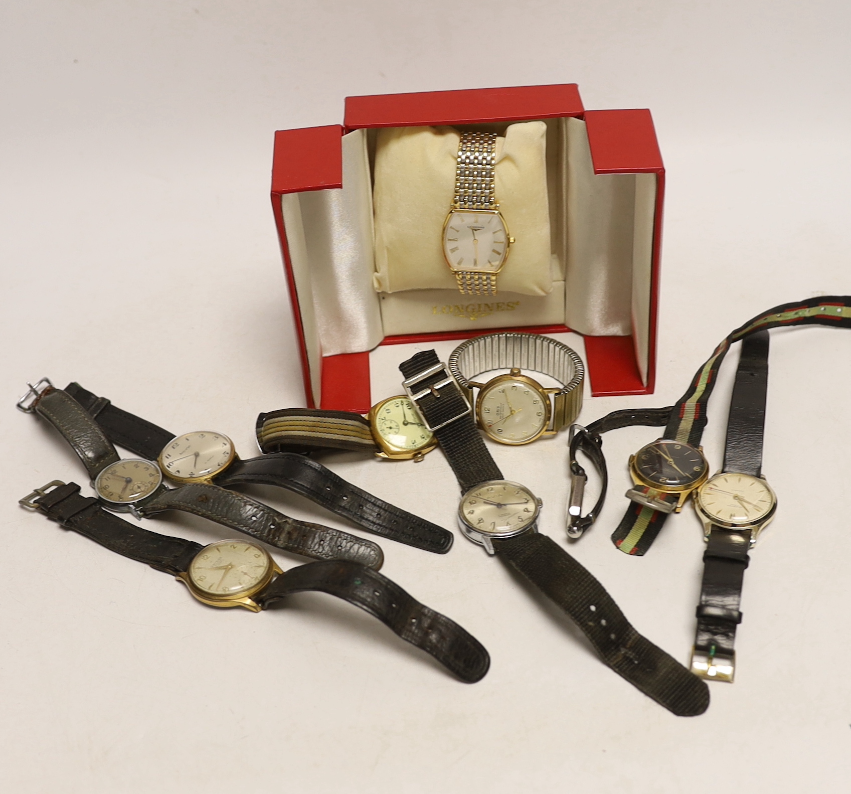 A gentleman's steel and gold plated Longines quartz wrist watch, with box, a lady's steel Jaeger LeCoultre manual wind wrist watch and eight other assorted gentleman's wrist watches including Ingersoll, Accurist and Oris
